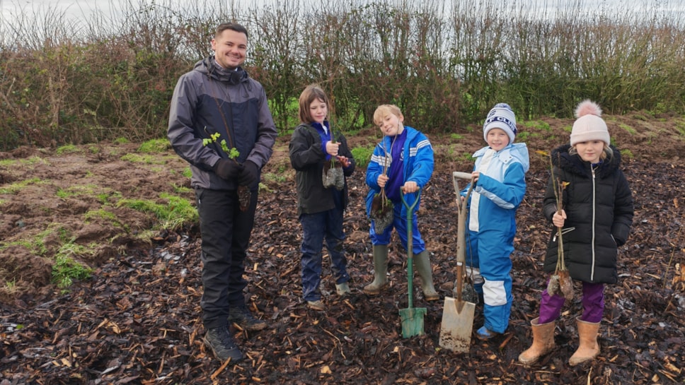 Councillor Joshua Roberts tree planting with youngsters in Treales