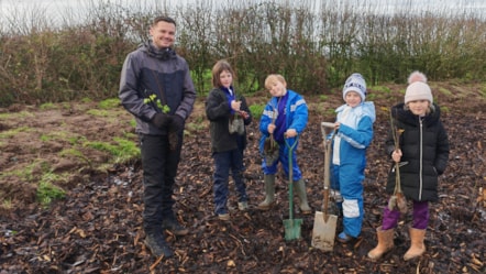 Councillor Joshua Roberts tree planting with youngsters in Treales