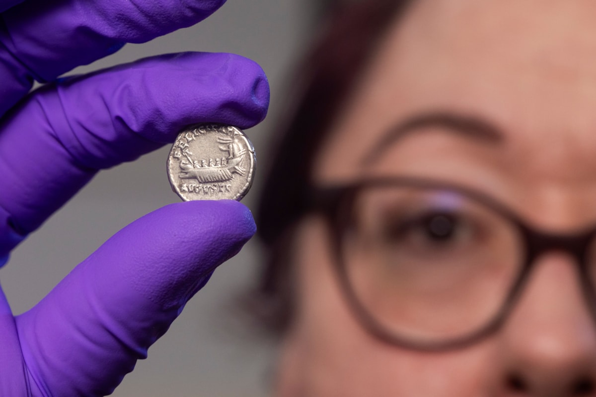 Conservator Carolyn Keene examines a Roman silver denarius. Image © Duncan McGlynn (2)