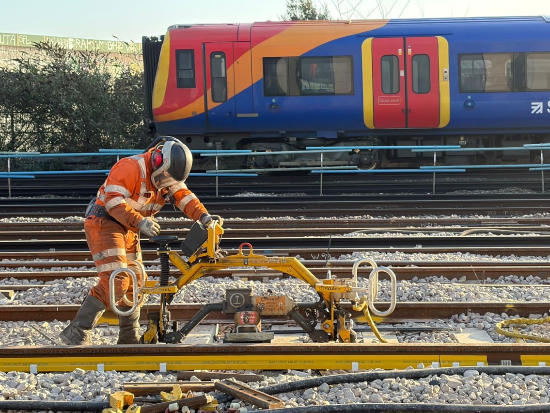 Work at Queenstown Road with a SWR train passing