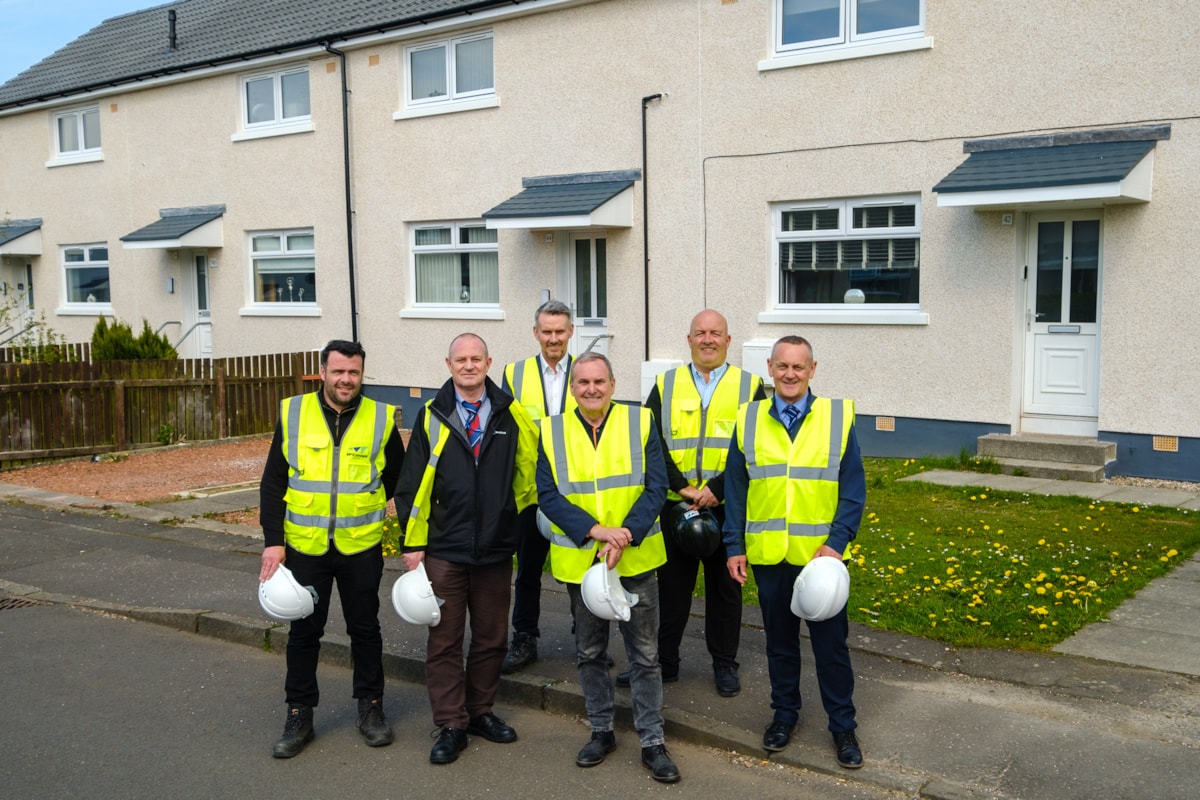 Cllr McMahon with Housing Asset Services and the team from McConnell