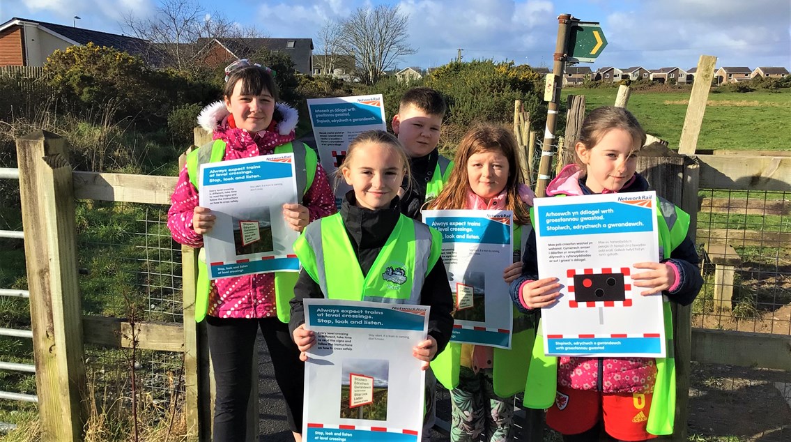 Harlech level crossing pupils: (Pictured: Paige Kelly (front centre) has been boosting level crossing safety messaging since her near miss with a train in Harlech, in 2021)
