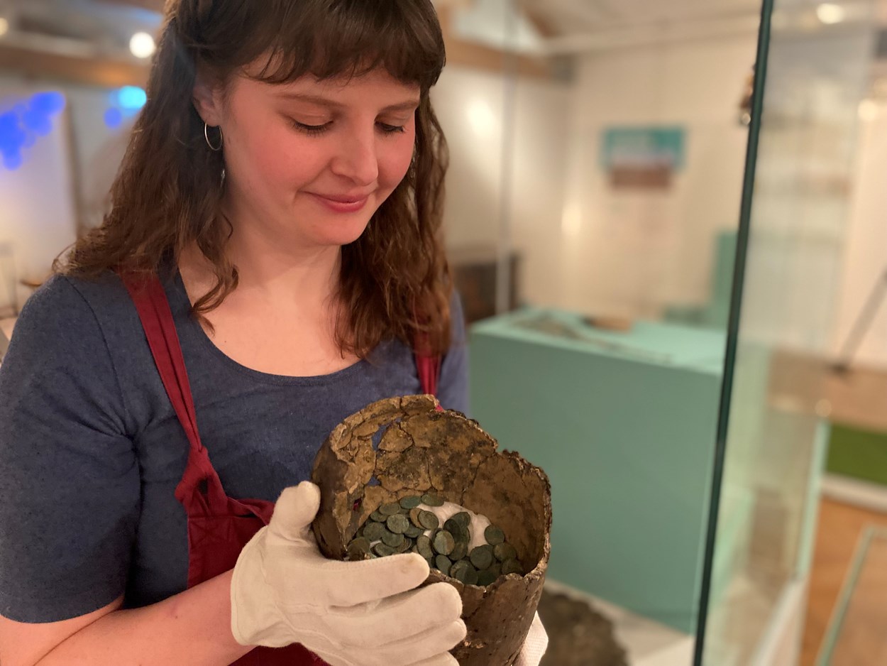 Money Talks hoards: Rachael Dilley, Leeds City Museum's curator of exhibitions, with the Cridling Stubbs Hoard, a remarkable stockpile of copper coins which may have been concealed by the owner inside a large jar in around AD 346 in a bid to keep the riches inside safe from Saxon and Irish raiders.