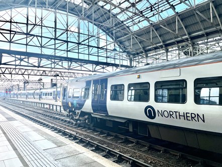 Image shows Northern train at Manchester Piccadilly