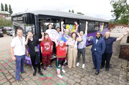 Mubs Mahmed (second right) and driver trainer Debbie celebrate with teachers and students