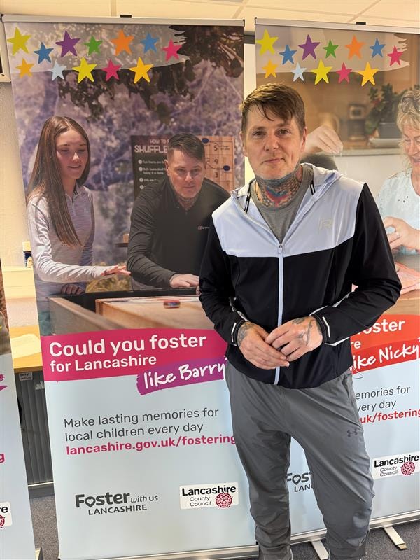 Foster carer Barry with his campaign poster