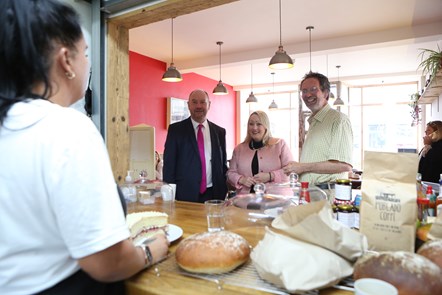 Cafe/kitchen pic: L-r: Shan Humphreys , waitress; Cefin Campbell MS; Rebecca Evans, Finance and Local Government Minister; Ben Gregory, Board Secretary