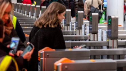 Image shows customer at ticket gateline cropped