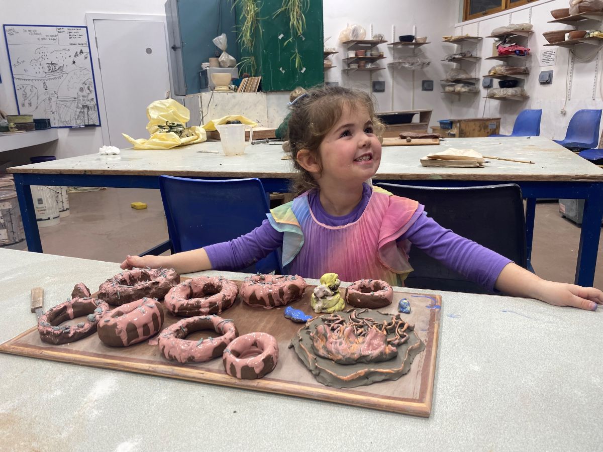 Indie, 4, in a ceramics workshop as part of Teulu