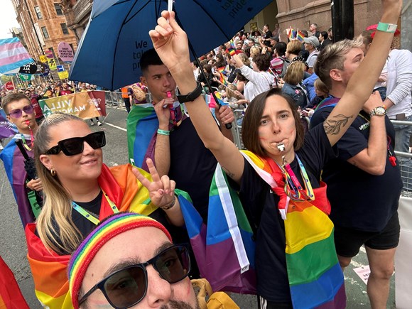 Colleagues celebrating in the parade