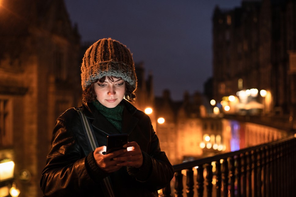 woman on phone at night