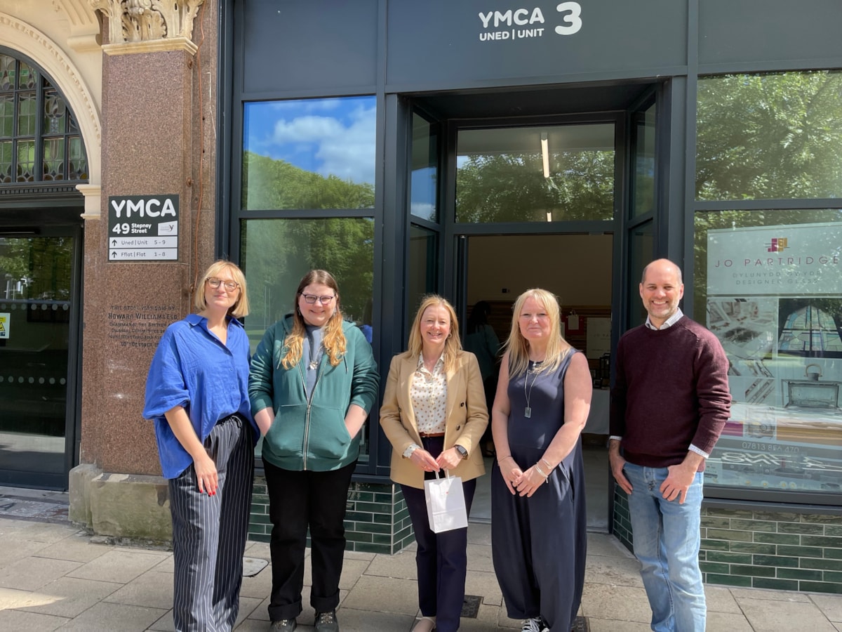 Cabinet Secretary for Housing and Local Government (centre) with local business owners in Llanelli.