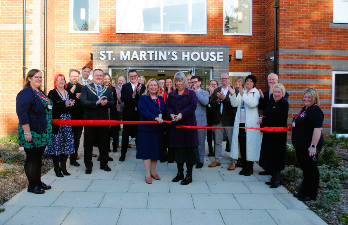 Selina White, Chief Executive of Magna Housing (centre left), and Caroline Tapster, Chair of Care Dorset (centre right), cut the ribbon at St Martin's House Extra Care Housing development in Gillingham, Dorset, 13 November 2024.