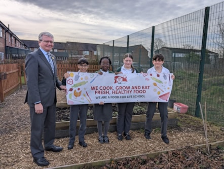 Pupils celebrate their bronze Food For Life award with Cllr Green