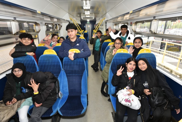Schoolchildren on a Northern train for Leeds station safety week, Network Rail
