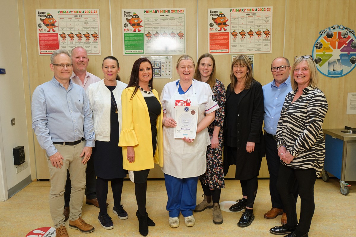 Eleanor Geddes is congratulated by Cllr Maitland, representatives from Food for Life, Andrew Kennedy, Mark Hunter, Chris Walker and Susan Dunlop from Catering Services