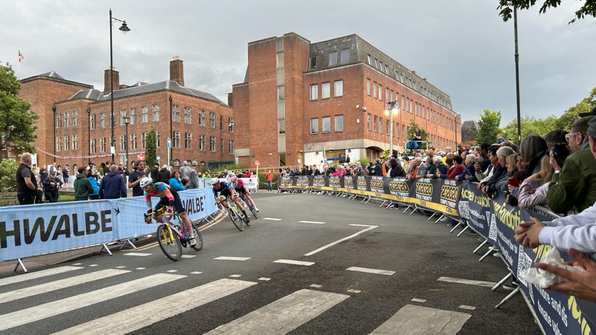 Spectators watch the open category race on Priory Road (cropped)