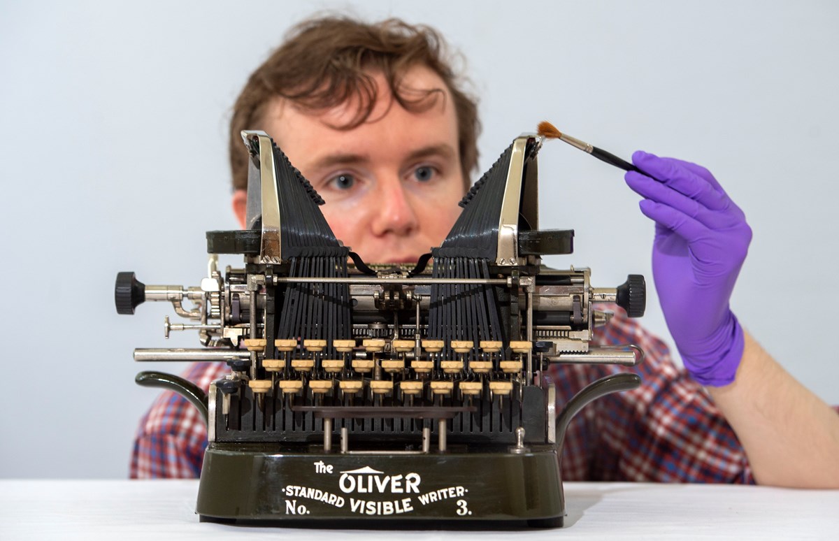 PhD student James Inglis takes a closer look at an Oliver Standard Visible Writer No. 3. Photo © Neil Hanna-3