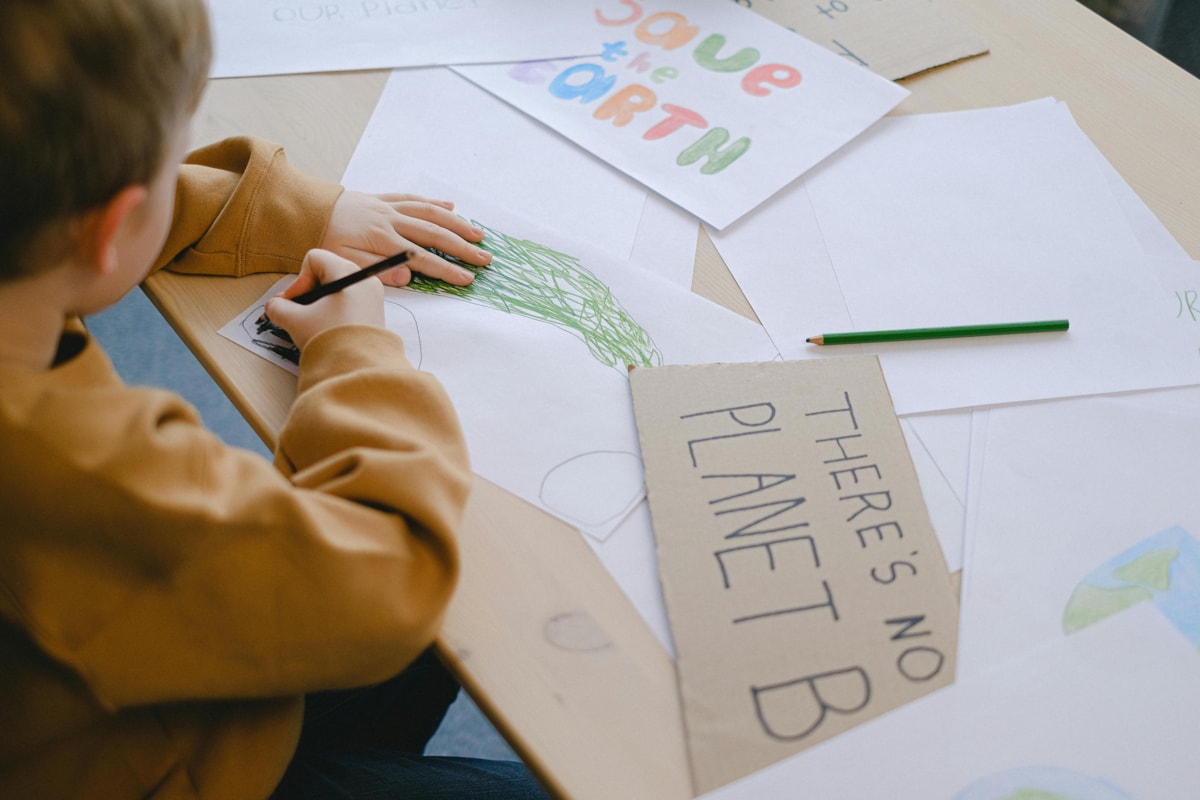 Child making climate change posters