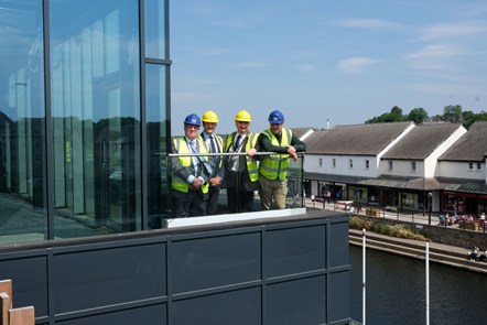 Cllrs David Simpson, Paul Miller and Tom Tudor with CEO Will Bramble on roof terrace