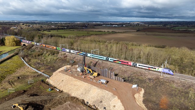 Five-year investment plan for ‘Backbone of Britain’ railway revealed: Blisworth earthworks drone shot with Avanti Progress Train passing by