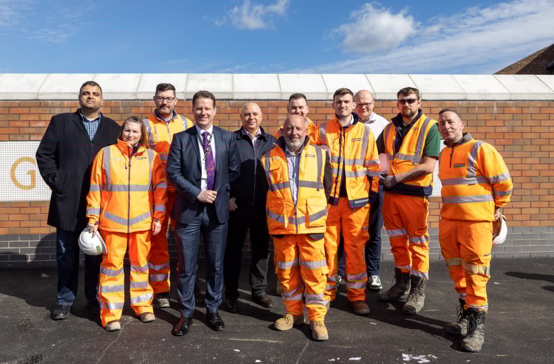 Network Rail's John Dixon and MP Navendu Mishra with the team
