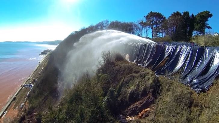 High-powered pumps used to created controlled erosion at Teignmouth