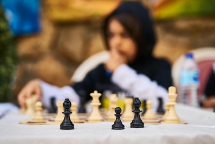 Girl playing chess outside