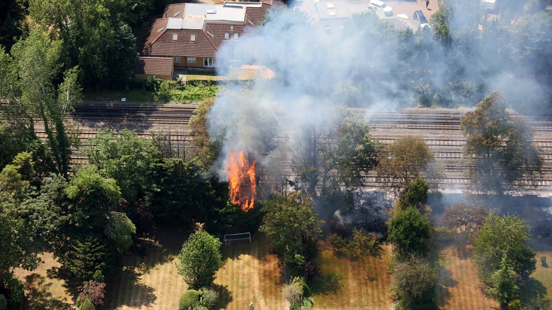 Trees on fire beside West Coast main line in Harrow Greater London July 19 2022