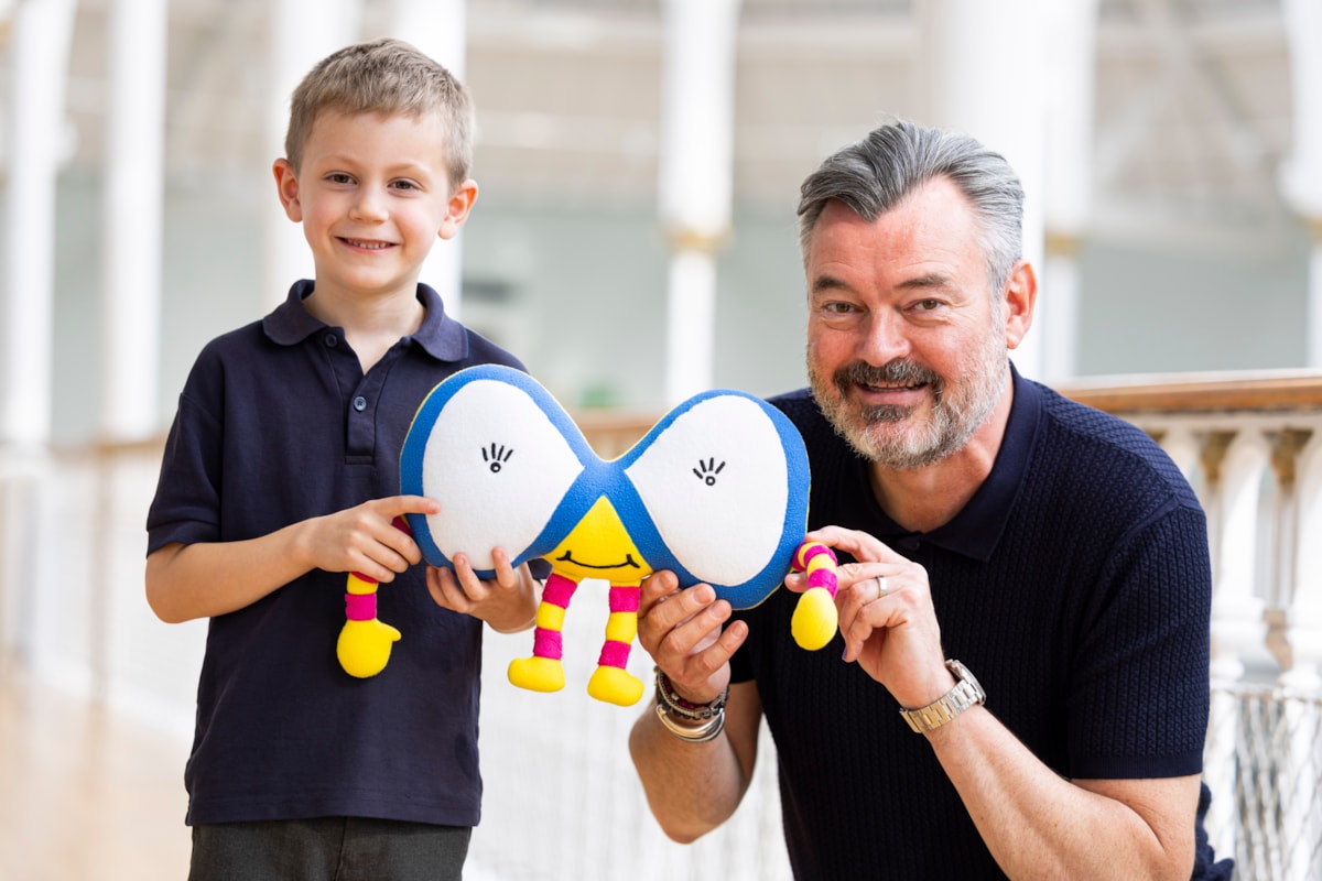 Grant Stott presents 7-year-old William Lunsden with his winning Mathscot design at the National Museum of Scotland. Photo (c) Duncan McGlynn (2)