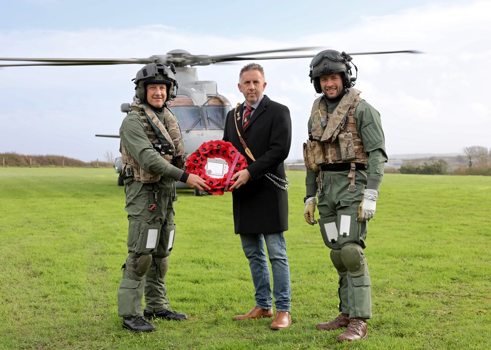 RNAS Culdrose personnel Lieutenant Commander Steve Ivill, left, and Petty Officer Aircrewman James Armstrong, with The Veterans Charity trustee Iain Henderson, centre