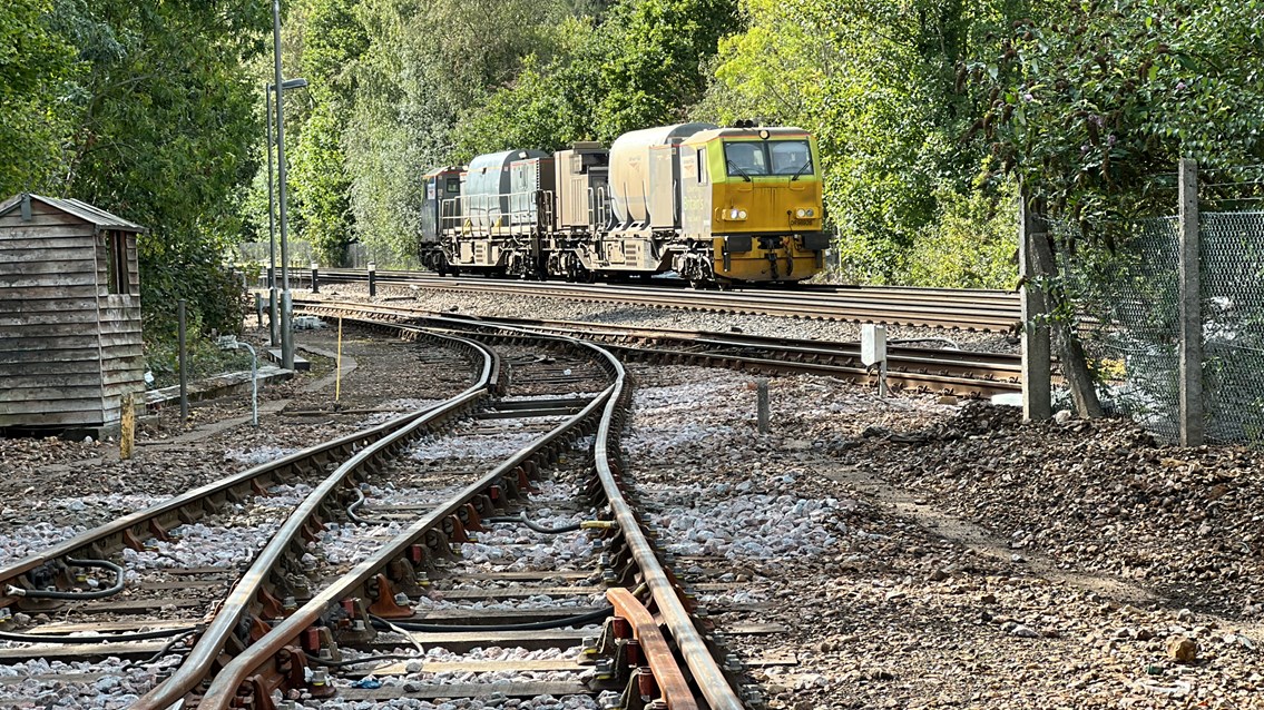 An MPV in operation travelling through Effingham Junction station