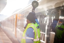 Colleague dispatching train at London Bridge: Colleague dispatching train at London Bridge