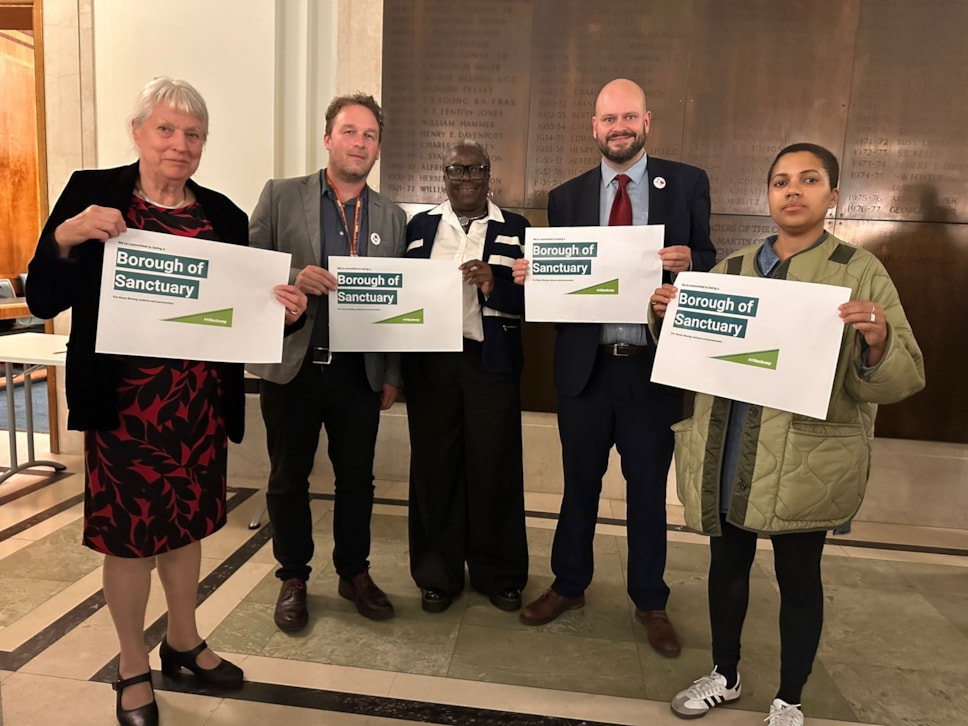 Councillors with Borough of Sanctuary signs