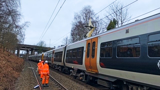 Teams working to release trapped train