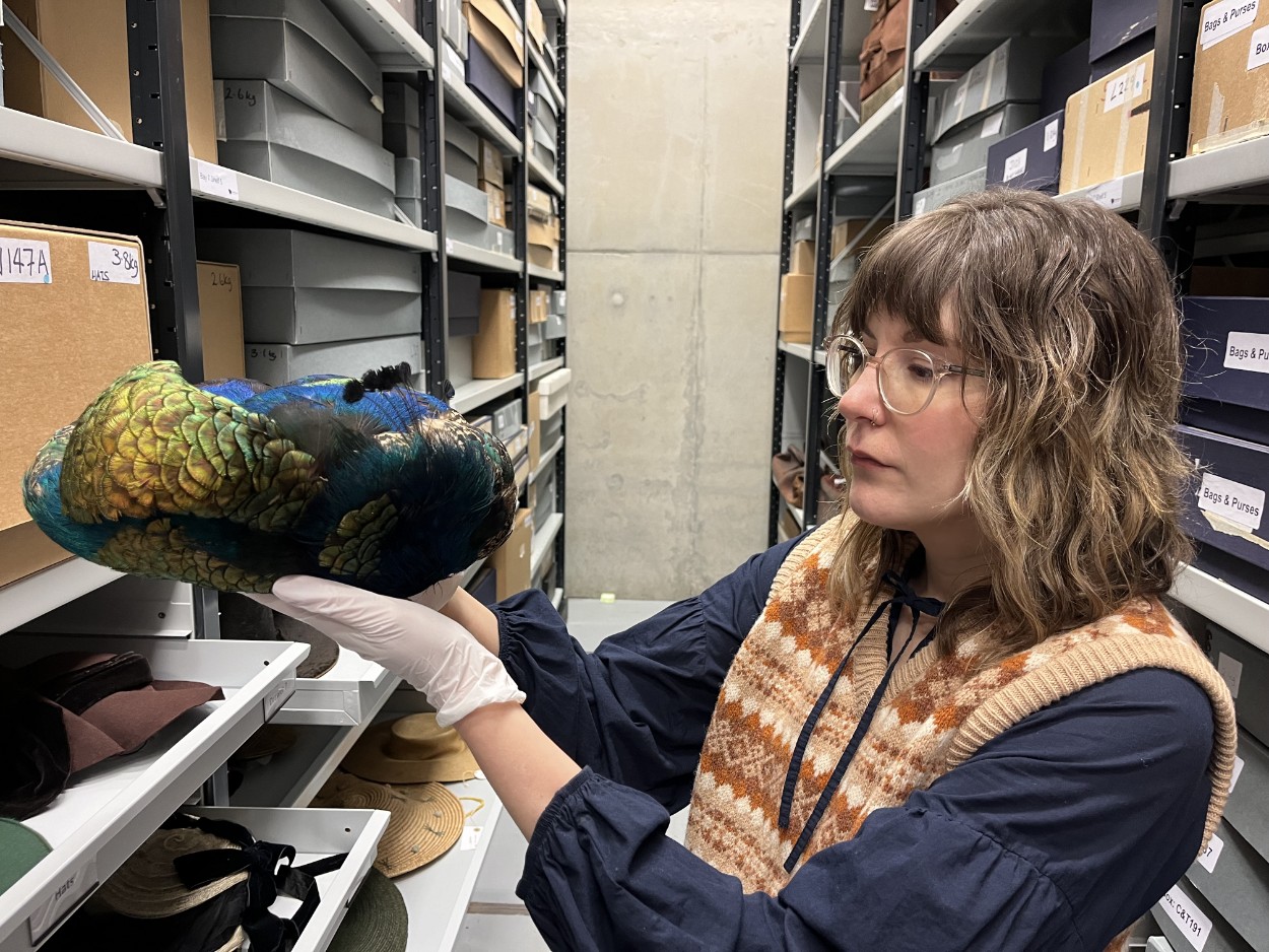 Leeds Discovery Centre hats: Leeds Museums and Galleries audience development officer Sara Merritt holds an Edwardian hat made using peacock feathers. The hat, part of the collection at Leeds Discovery Centre, dates from a time when feathers on hats were used in huge quantities.