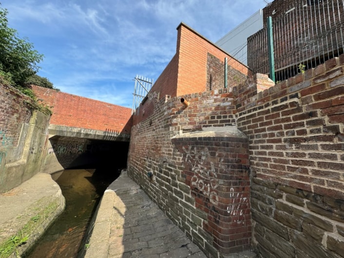 £1.5 million flood resilience scheme protecting over 300 homes and businesses is complete: Sheepscar Beck - Section of the channel by Mushroom Street after the works with repaired brickwork and new outfall cropped