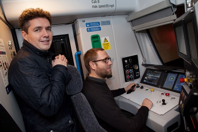 Rail Minister celebrates start of ECDP digitally signalled passenger services: Huw Merriman in cab with Great Northern Testing and Commissioning Driver Paul Field