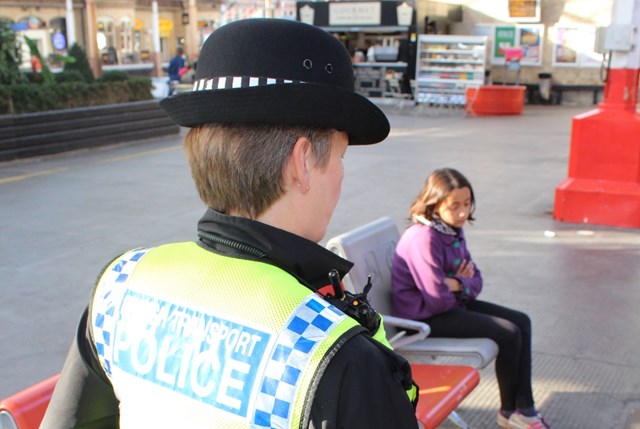 Railway Children Sleepout: BTP officer approaching girl (model) sat alone in station