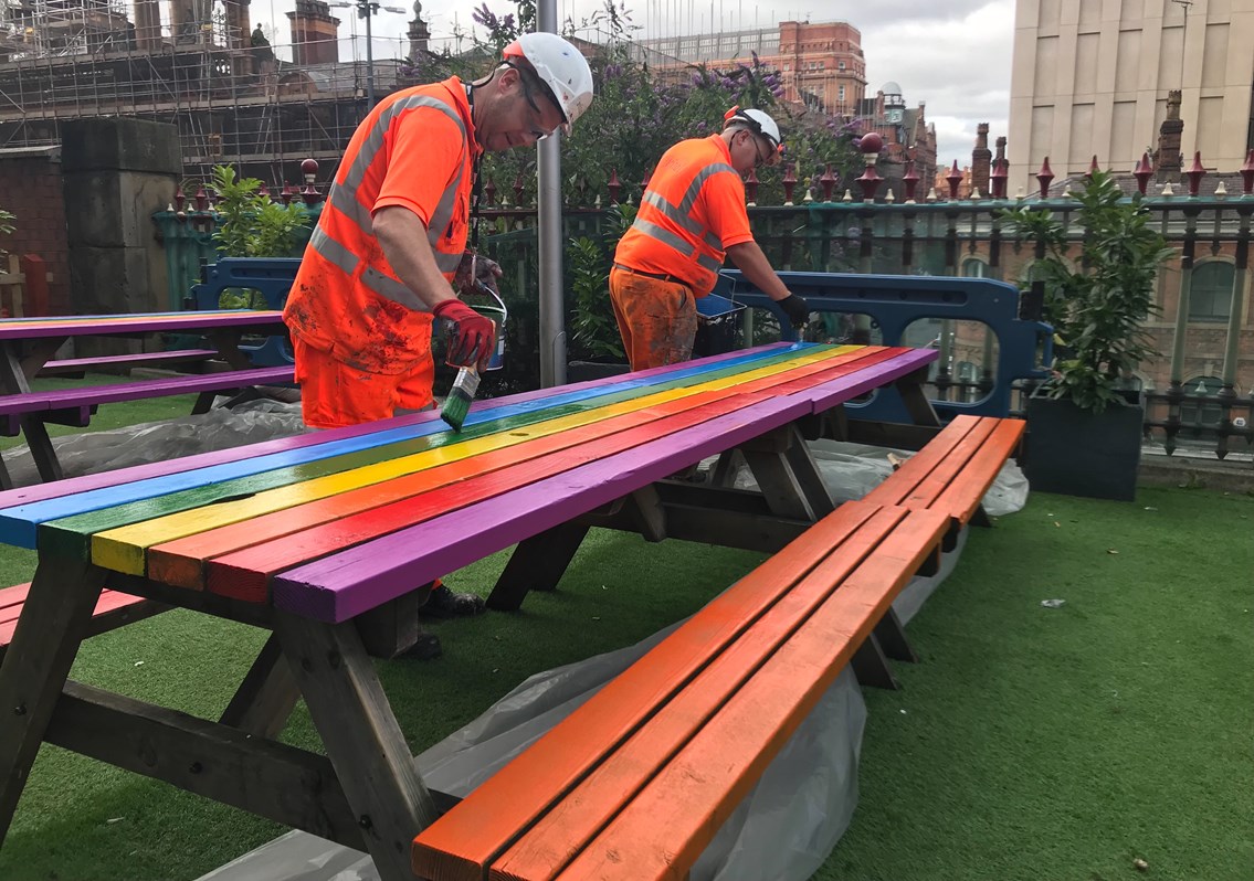 The picnic benches getting the Pride treatment at Manchester Piccadilly