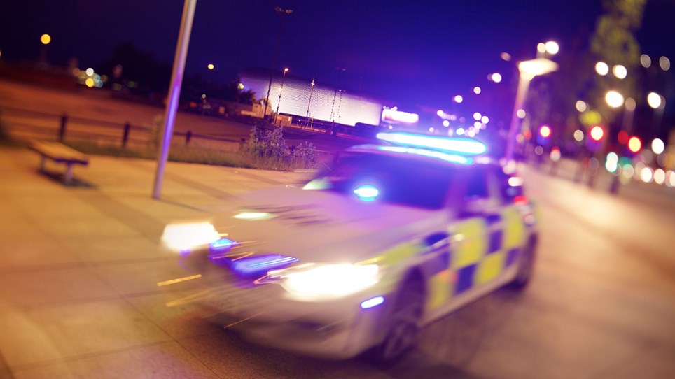 Police car at night - Hero Image