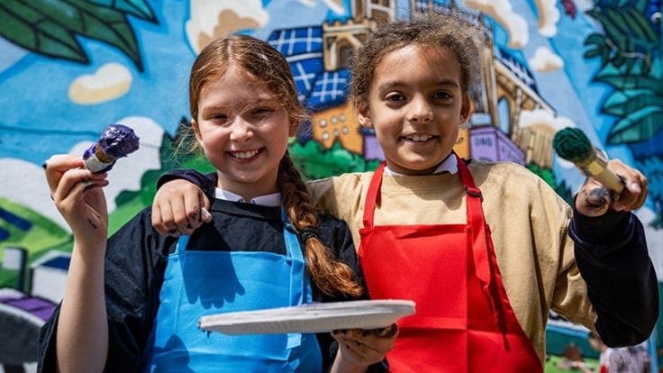 children-smiling-at-mural-hero-D