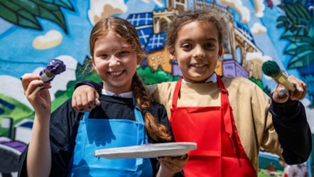 children-smiling-at-mural-hero-D