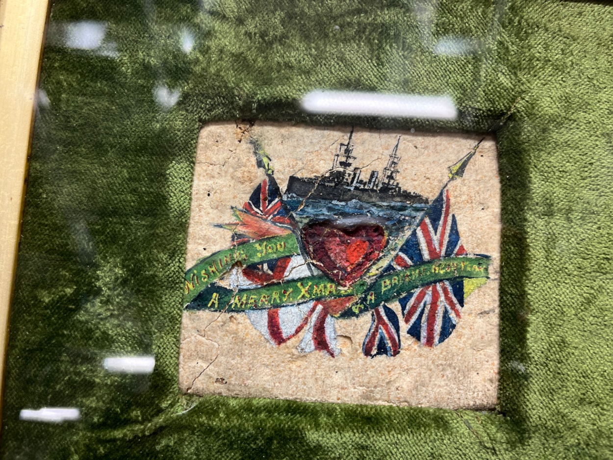 Biscuit messages: The decorated biscuit from 1914, beautifully painted with an image of a battleship and carrying an inscription that reads ‘Wishing you a Merry Christmas and a bright new year’.
The fragile vintage snacks, more than a century old, were originally issued to servicemen as a durable emergency ration but were reputedly so unpalatable, they were instead repurposed as a humorous way of staying in touch with loved ones over Christmas.