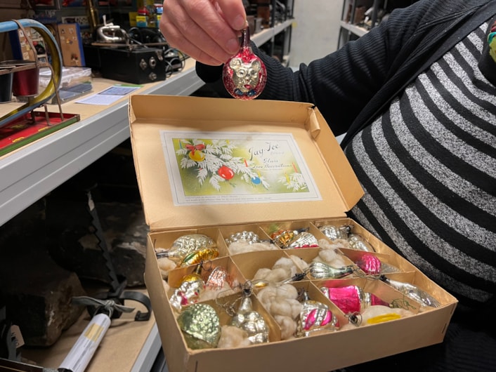 Biscuit messages: Also part of the collection is a set of Mickey Mouse Christmas tree lights as well as some brightly coloured glass baubles manufactured by Morley’s Briteglass Ltd. The Jay-Tee brand glass Christmas tree decorations were owned by local couple Herbert and Maud Storer who married in 1944.