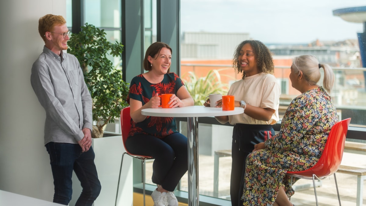 Colleagues in meeting - featuring Sarah Farmer cropped