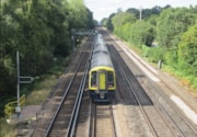Train passing WiFi pole: South Western Railway Class 158 train passing a 5G WiFi pole between Earlsfield and Basingstoke