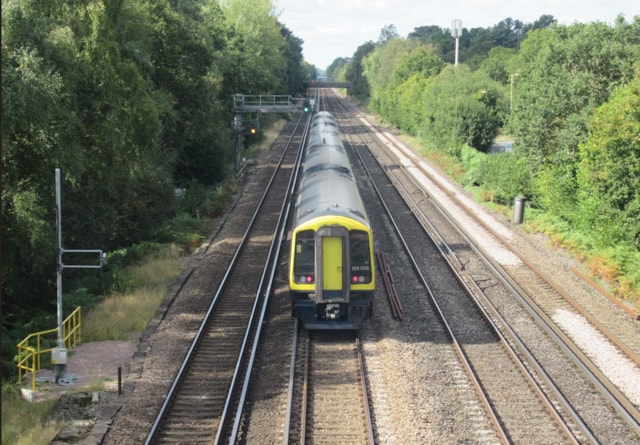 Train passing WiFi pole: South Western Railway Class 158 train passing a 5G WiFi pole between Earlsfield and Basingstoke