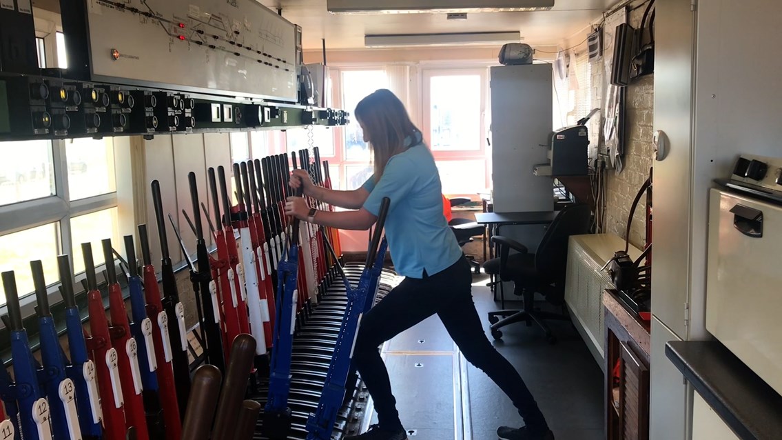 Amy working signal lever at Sellafield signal box