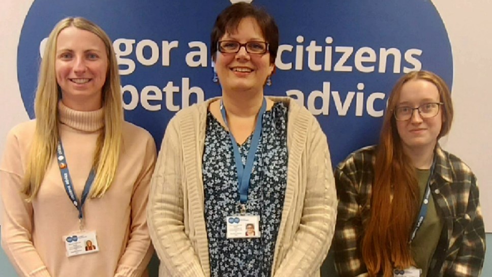 Three women from Citizens Advice stood in a line smiling